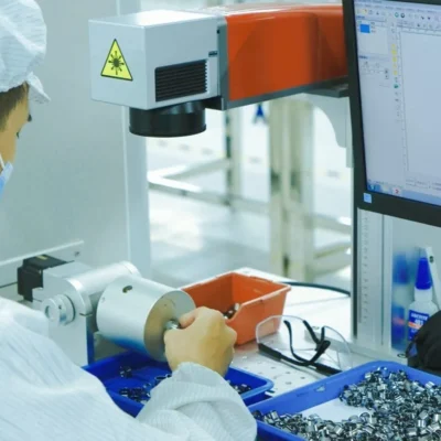 Workers assembling electronic cigarettes on a production line at GG-Vape factory in Dongguan. Professional OEM/ODM manufacturing.